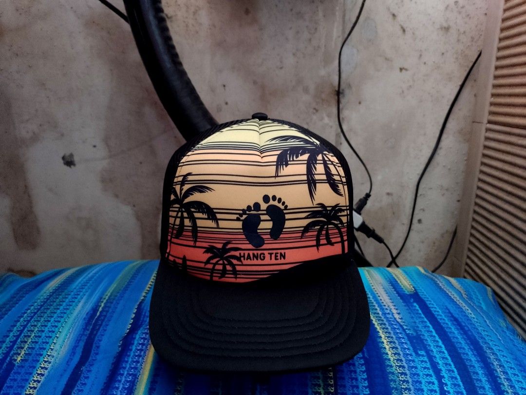 Hang Ten Authentic Surf Brand, Adjustable Snapback Trucker Hat/Net Cap (Category: Caps & Hats) located in San Mateo. Submitted by JmThriftCap_Ph (Listing ID 1295893717, Image 1). Description: PLEASE READ THE DESCRIPTION 👇 *Excellent Condition *Rubberized Print Hang Ten Footprint Design & Laser Print Beach Vibes Design *Hang Ten Brand *Official Headwear, The Original California Brand Since 1960 *Perfect For Your Summer Outfit ⛱️ *Adjustable Snapb