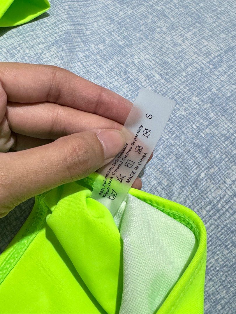 Neon Green Asymmetrical Two Piece Swimsuit (Category: Bikinis & Swimsuits) located in Manila. Submitted by itswayne (Listing ID 1295877596, Image 2). Description: used once only for costume purposes hehe super secured bottom, di kita singit dito swear small on tag but can fit up to medium top length: 11.8” bust: 27.6”.