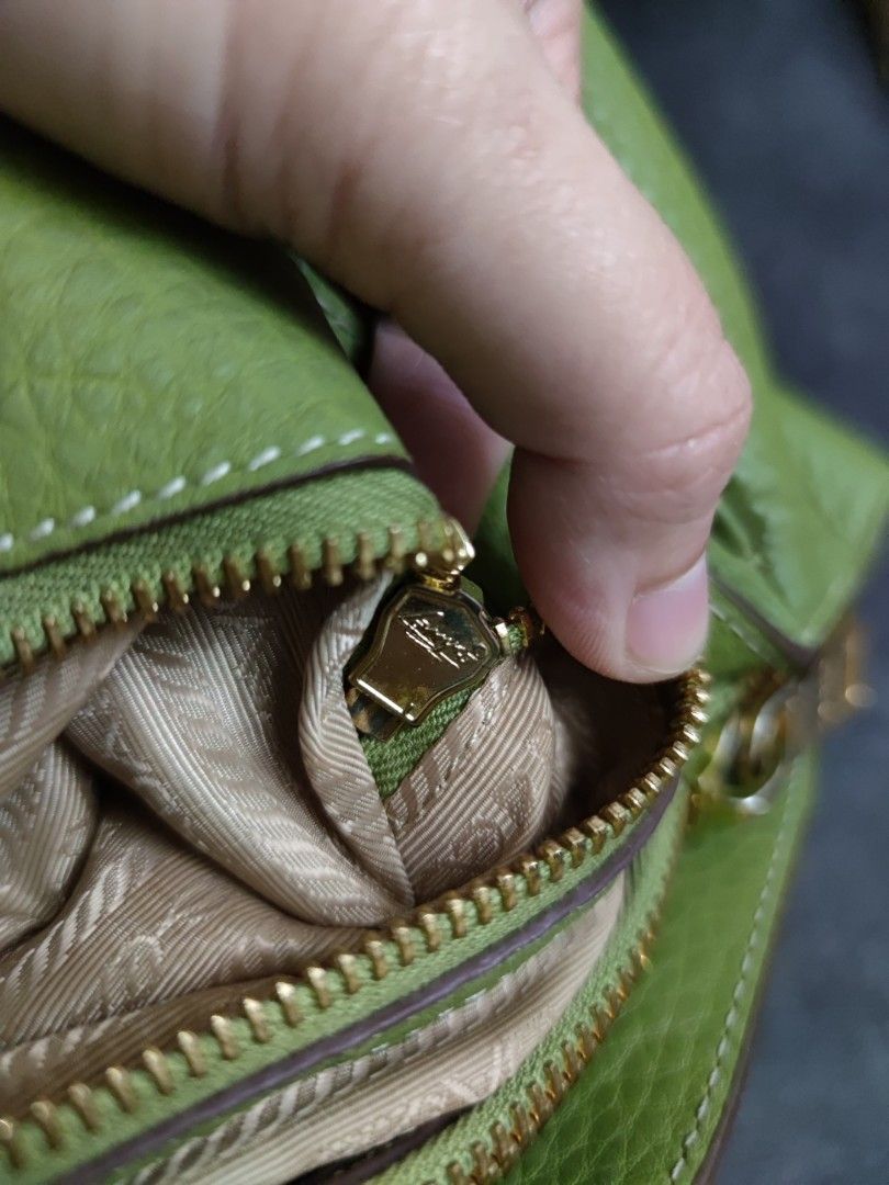 Prada (Category: Shoulder Bags) located in Kuantan. Submitted by itsmexariya (Listing ID 1295903296, Image 3). Description: Long strap not provided Comes with dustbag only Has signs of usage/stains/pen marks Exc postage.