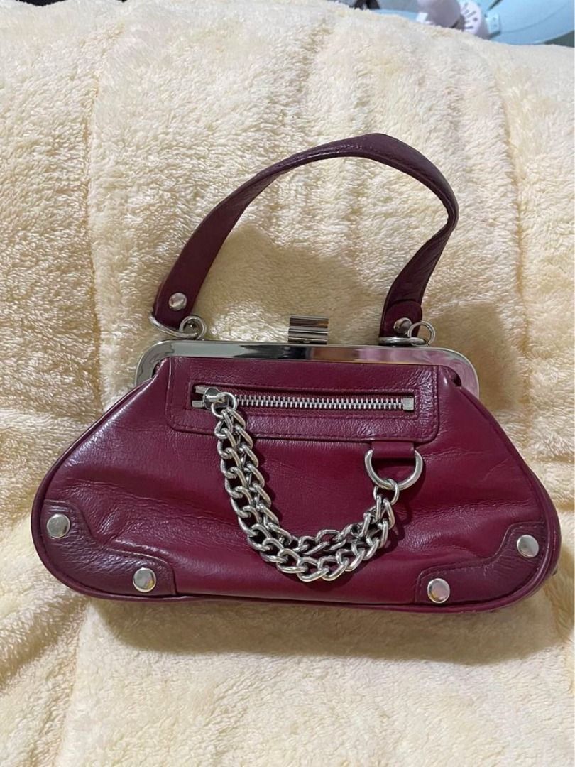 MAXIMA - WILSON'S LEATHER CHAINED AUTHENTIC LEATHER BAG (Category: Luxury Bags & Wallets) located in Pasig City. Submitted by healthnfeshn (Listing ID 1291140623, Image 1). Description: Maroon colored. Very nice in person. Good for party. Tiny bag..