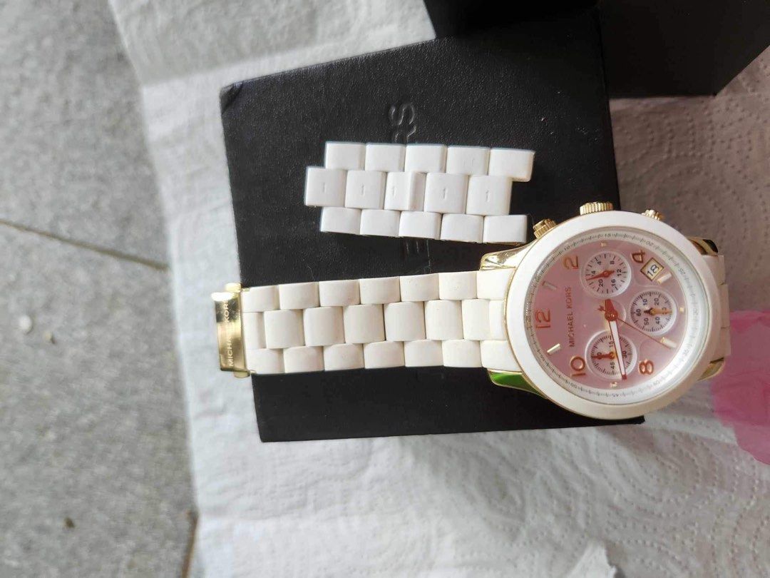 Michael Kors watch for women (Category: Women's Watches) located in Pasig City. Submitted by solelypreloved (Listing ID 1291067293, Image 2). Description: MK5145. U.S bought. Authentic. Chronograph White Silicone and Gold Steel Issue: Date aperture is not working. .