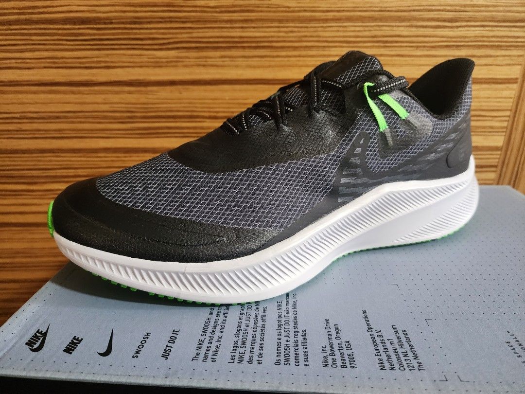 nike running quest 3 shield trainers in black