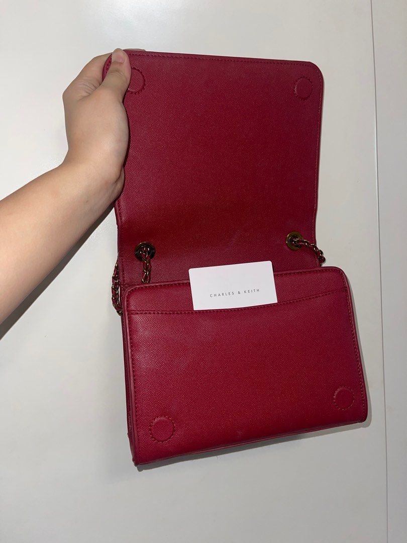 Charles & Keith cross body bag red (Category: Cross-body Bags) located in Meycauayan. Submitted by declutteringpat (Listing ID 1291262754, Image 3). Description: Red Slightly used. Rfs For disposal .