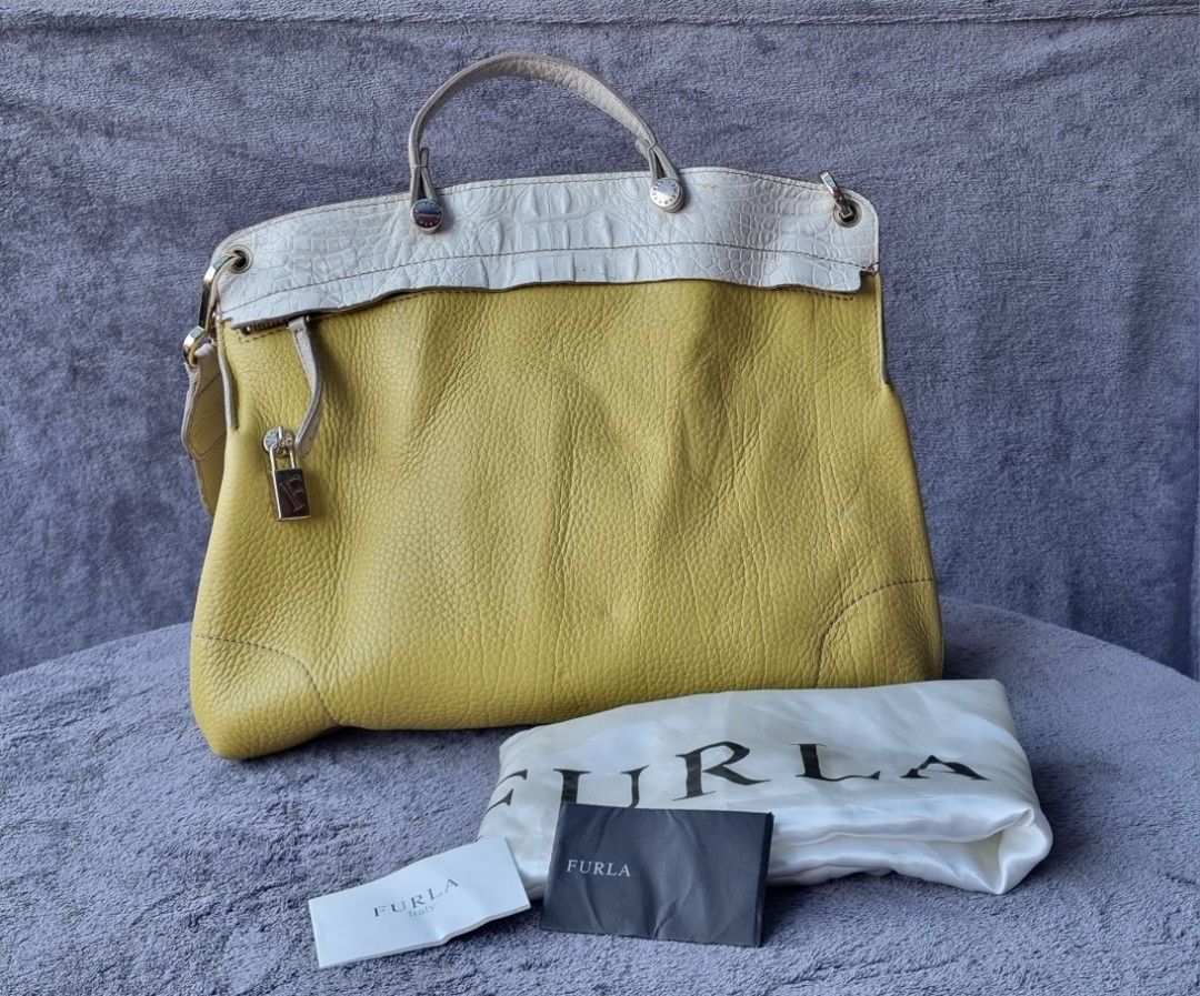 Furla Piper Lux Leather Satchel (Category: Luxury Bags & Wallets) located in Talisay. Submitted by parchiracollection (Listing ID 1291286336, Image 2). Description: *Complete inclusion *Has rubs in some areas of the bag but is barely noticeable. *plus SF *Please check detailed pictures before purchasing * This is a second-hand item, kaya wag po mag expect na BAGO *no to low ballers. The discounted price I'll give is the final price. *NO COD, NO C