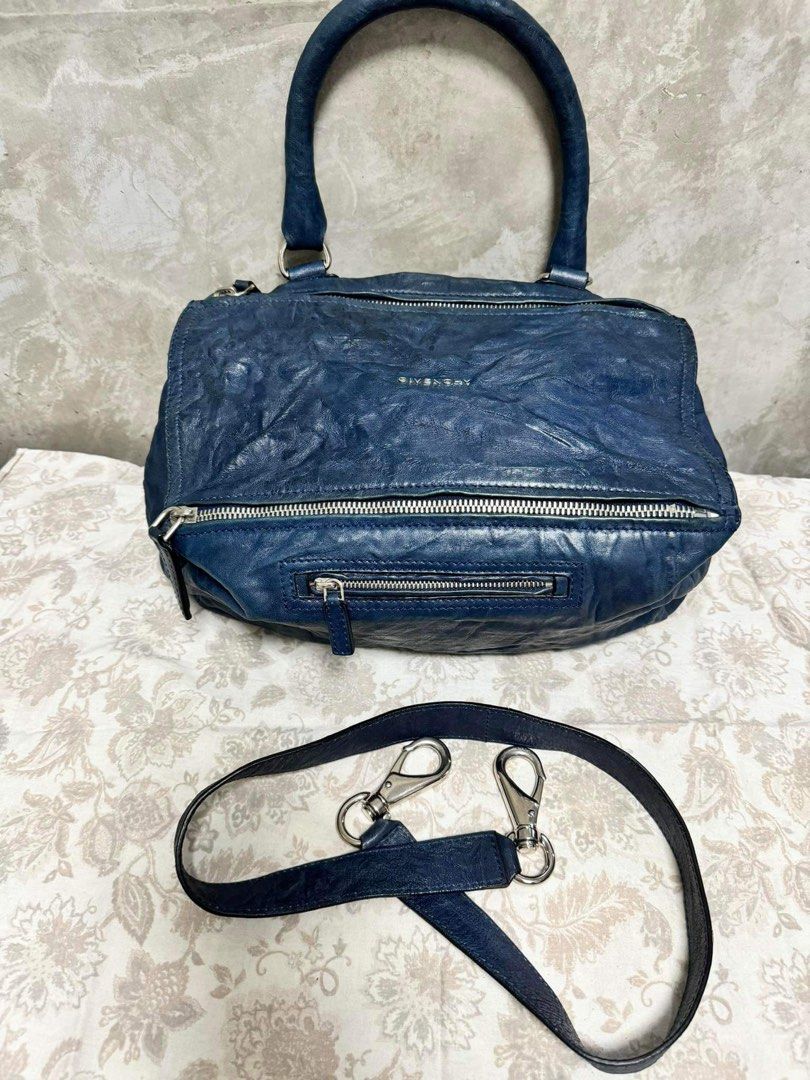 Givenchy Pandora (Category: Luxury Bags & Wallets) located in Batangas. Submitted by TaynsD (Listing ID 1291303525, Image 2). Description: Givenchy Pandora Medium Size Made from distressed leather No problem with hardware, zipper or handles Clean inside and out Comes with original dustbag RFS: Decluttering and too many bags in blue color.