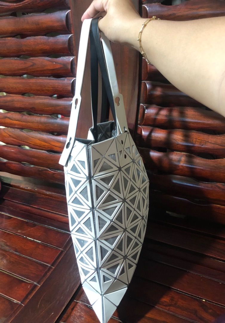 ISSEY MIYAKE PRISM TOTE (Category: Luxury Bags & Wallets) located in Lucena. Submitted by gracious_chin0436 (Listing ID 1291317713, Image 3). Description: Still in very good condition Normal to minimal sign of used only no major flaws/issue With some light color stain but unoticeable on strap and body Kindly check each pics for bag details and condition .