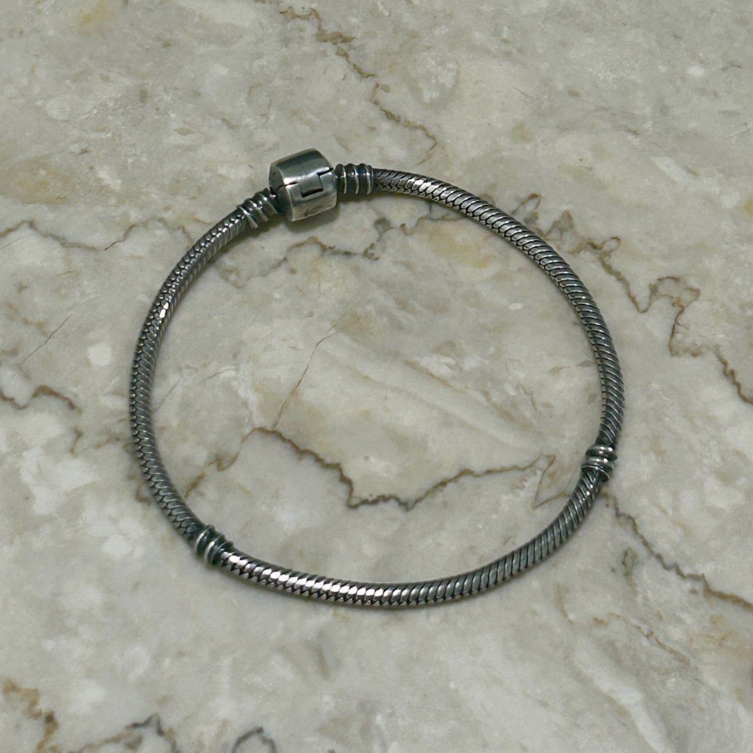 Pandora inspired genuine 925 bracelet (Category: Bracelets) located in Manila. Submitted by ted6875 (Listing ID 1291278838, Image 3). Description: This is a Pandora-inspired bracelet in genuine 925 silver. Please see details: -Genuine 925 silver -Bracelet -Inspired by classic Pandora style bracelet -Fits most Pandora charms -Non-tarnish, but it does oxidize when you’re acidic or when you don’t wear it. So use and polish regularly to keep its shin