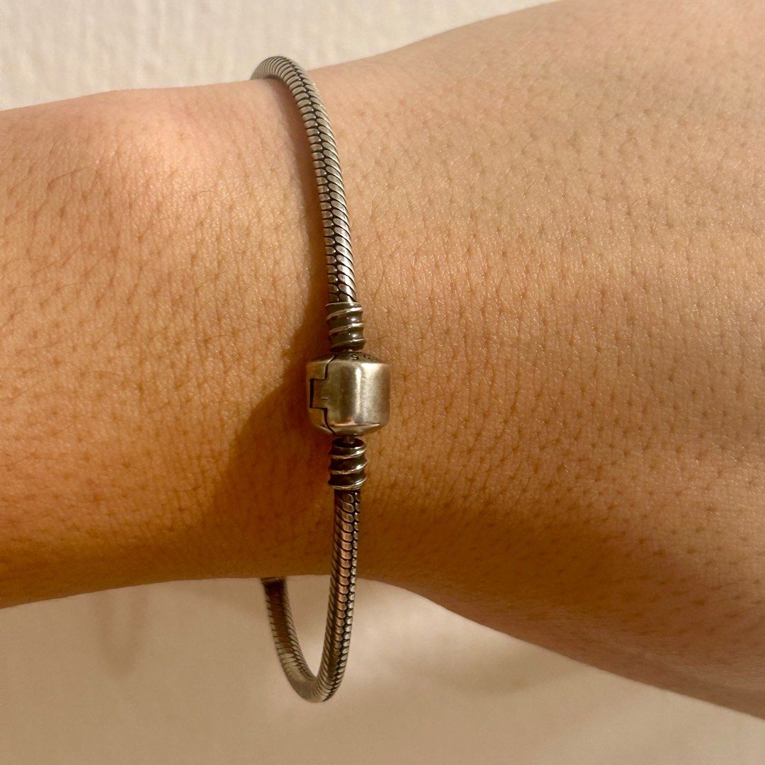 Pandora inspired genuine 925 bracelet (Category: Bracelets) located in Manila. Submitted by ted6875 (Listing ID 1291278838, Image 2). Description: This is a Pandora-inspired bracelet in genuine 925 silver. Please see details: -Genuine 925 silver -Bracelet -Inspired by classic Pandora style bracelet -Fits most Pandora charms -Non-tarnish, but it does oxidize when you’re acidic or when you don’t wear it. So use and polish regularly to keep its shin