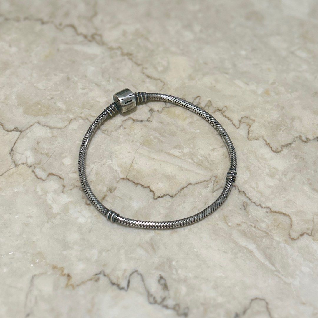 Pandora inspired genuine 925 bracelet (Category: Bracelets) located in Manila. Submitted by ted6875 (Listing ID 1291278838, Image 1). Description: This is a Pandora-inspired bracelet in genuine 925 silver. Please see details: -Genuine 925 silver -Bracelet -Inspired by classic Pandora style bracelet -Fits most Pandora charms -Non-tarnish, but it does oxidize when you’re acidic or when you don’t wear it. So use and polish regularly to keep its shin