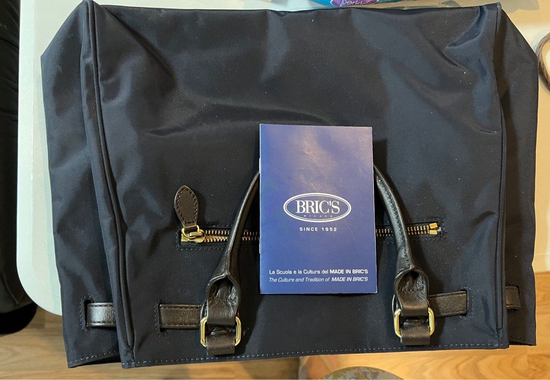 Bric’s Milano Navy Tote (Category: Tote Bags) located in Quezon City. Submitted by actank (Listing ID 1291377660, Image 3). Description: Barely used. With leather handles and gold hardware With care card Versatile navy and black color .
