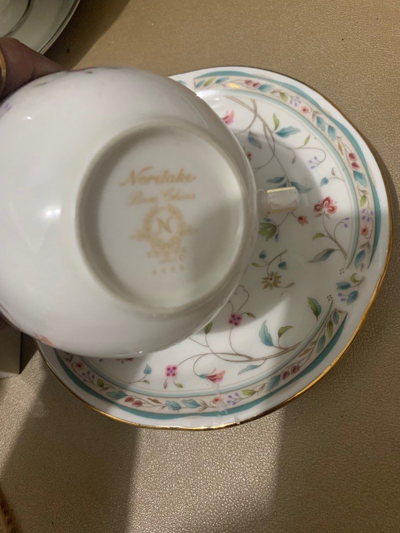 Cozy Noritake Cup w/ 2pcs Saucer (Category: Coffee & Tea Tableware) located in Bulacan. Submitted by fancy.surplusera (Listing ID 1291519060, Image 3). Description: Collectible Noritake Duo. Branded surplus item from Victoria Surplusera!!!🤩 Made in Japan perfect for personal salad plate use, coaster even for a pictorial accent. Condition: 7/10 Issue: fades and rubs sa gold lining as sign of use, no chip or crazing. Size: Thickness: 3mm Surplus I