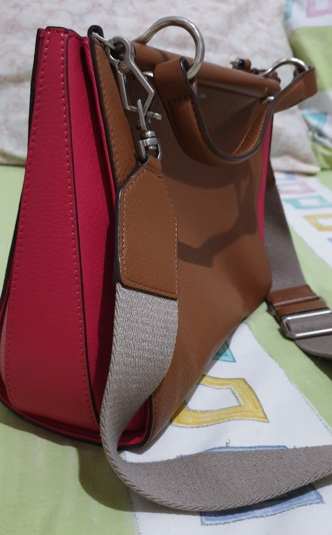 Louise Et Cie 2 Way Leather Bag (Category: Cross-body Bags) located in Manila. Submitted by graceperz (Listing ID 1291464069, Image 3). Description: From US Leather body, canvas polyester straps Double snap closures Color brown/pink combination Has minor flaws (please see picture) Can be used as handbag or crossbody bag Dust bag included.