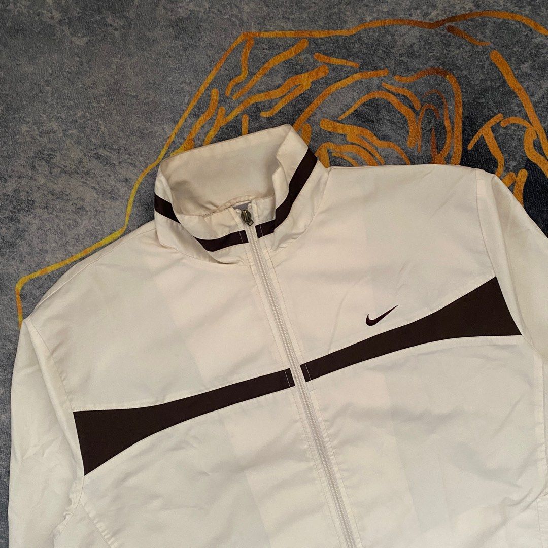 White nike windbreaker with gold logo deals