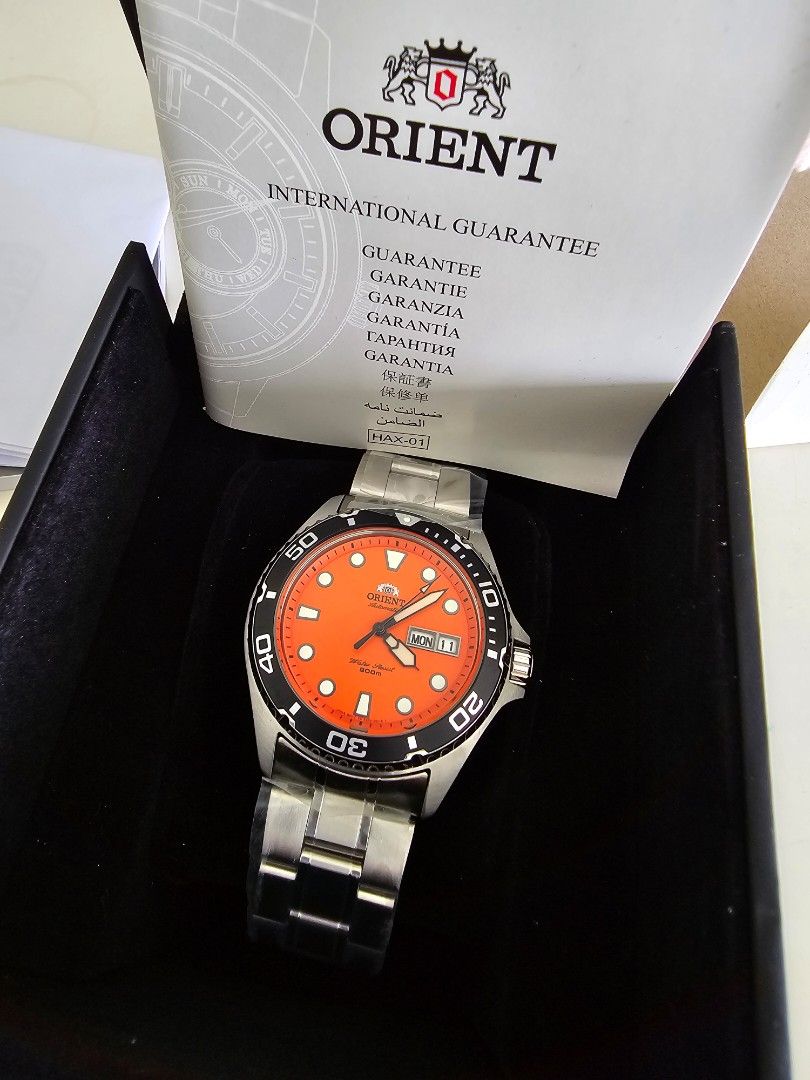 Orient Automatic (Category: Men's Watches) located in Singapore. Submitted by time.keeper (Listing ID 1291595339, Image 1). Description: [BNIB full set] Orient 200m divers watch orange dial bracelet unsized with stickers Purchased on 19.3.2022.