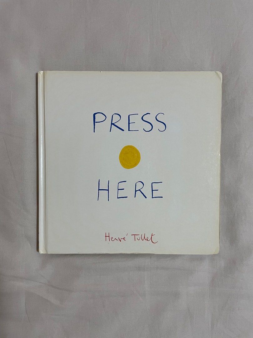 Press Here by Herve Tullet Hardcover Book (Category: Storybooks) located in Pasig City. Submitted by happyen (Listing ID 1291717662, Image 1). Description: Minor shelf wear on the cover Complete pages, no folds, no writings inside This hardcover version is P927 in fully booked.