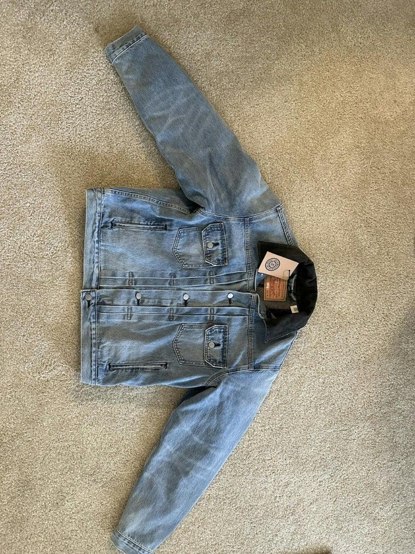 Stussy x Levi's denim jacket (Category: Coats, Jackets and Outerwear) located in Taguig. Submitted by stryan (Listing ID 1291612665, Image 1). Description: Condition: 10/10 never worn No issues Complete with tags expect size to be a bit big due to the fact that its in american size Medium on tags but can fit up to large as long as body is slim toned. Also gives oversized and 90's aura into it. Chest: 24 in Length: 22 in Sleeve length: 35 in Sligh