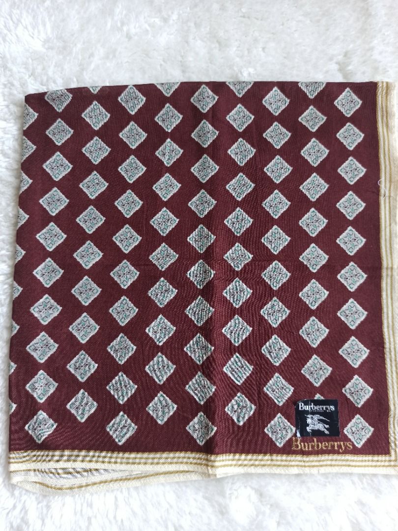 Burberrys Vintage hanky (Category: Luxury Accessories) located in Mati. Submitted by surkayconsumergoodstraiding (Listing ID 1291743357, Image 2). Description: Burberrys handkerchief. for men From Japan box. buy 3 handkerchiefs to get 1 free scarf. With its dark color, this hanky is ideal as stains or dirt won't be easily visible, ensuring a neat appearance even after multiple uses..