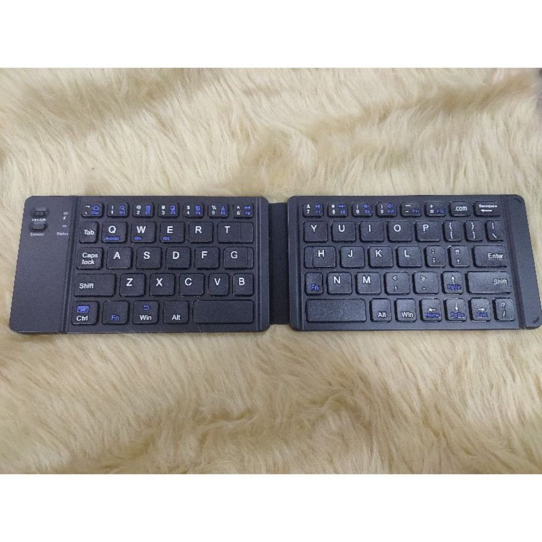 Folding Bluetooth Keyboard (Category: Computer Keyboard) located in Manila. Submitted by sdfsolutions (Listing ID 1291840191, Image 2). Description: Shift 9 Win Ctr Enter CE FC Res Magnetic closure .Rechargeable buit-in Lithium-ion battery with UP to 40 hours working tpme/ Includes Micro USB charging cable 2.6 ft (80CM) .Operating range: Up to 32 feet(10M).