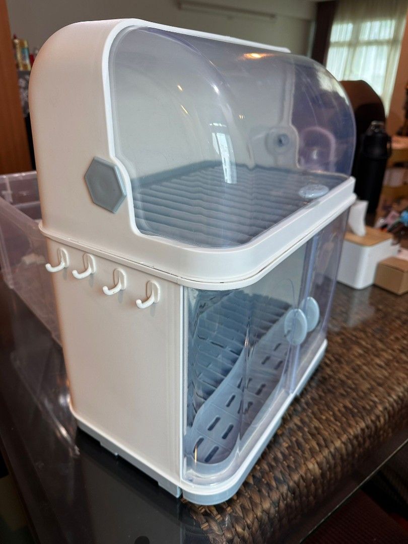 Tableware storage (Category: Bathroom & Kitchen Fixtures) located in Singapore. Submitted by neo_sg (Listing ID 1291779478, Image 3). Description: Brand new already assembled. Bought extra. 2 layers with lid and draining rack. Cutlery, plates, cups, milk bottles storage..
