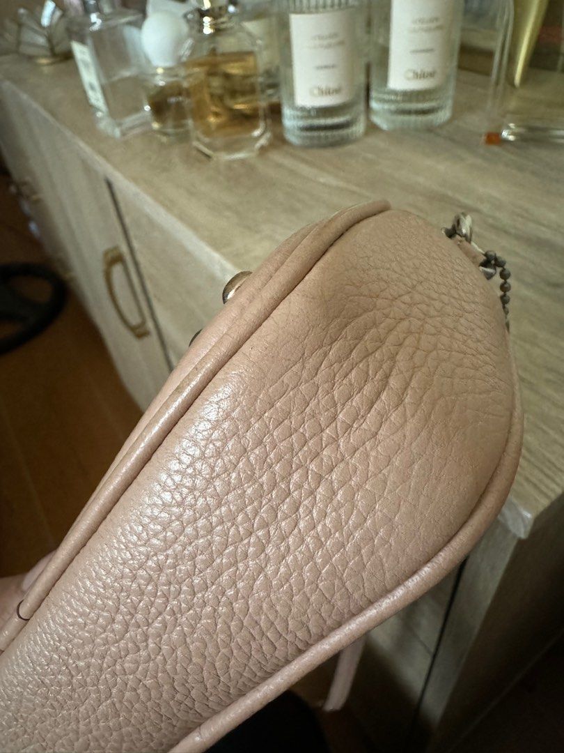 Coach crossbody pouch with rivets (Category: Cross-body Bags) located in Quezon City. Submitted by mmmcat (Listing ID 1291937634, Image 3). Description: Polished pebble leather with lacquer rivets Double zip compartments Inside credit card slots Zip top closure Fabric lining Adjustable leather strap for shoulder or crossbody wear L 7.5” x H 4.5” x W 2.5”.
