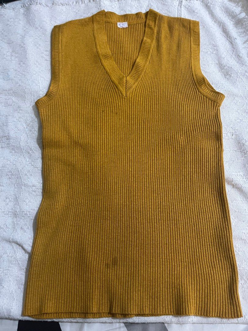 Mustard sleeveless ribbed knit (Category: Sleeveless) located in Pasig City. Submitted by aac2021 (Listing ID 1292022485, Image 2). Description: RFS : Decluttering Dimes : 26 - 36 inches x 23 inches Can fit from small to medium .
