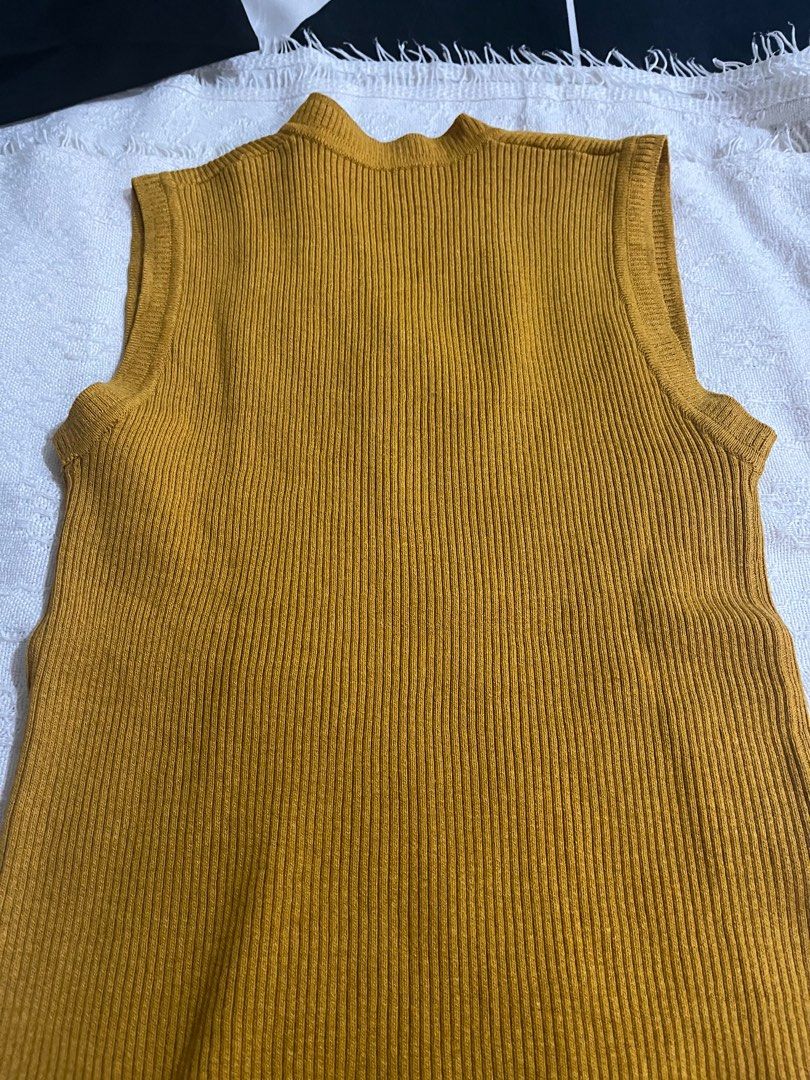 Mustard sleeveless ribbed knit (Category: Sleeveless) located in Pasig City. Submitted by aac2021 (Listing ID 1292022485, Image 3). Description: RFS : Decluttering Dimes : 26 - 36 inches x 23 inches Can fit from small to medium .
