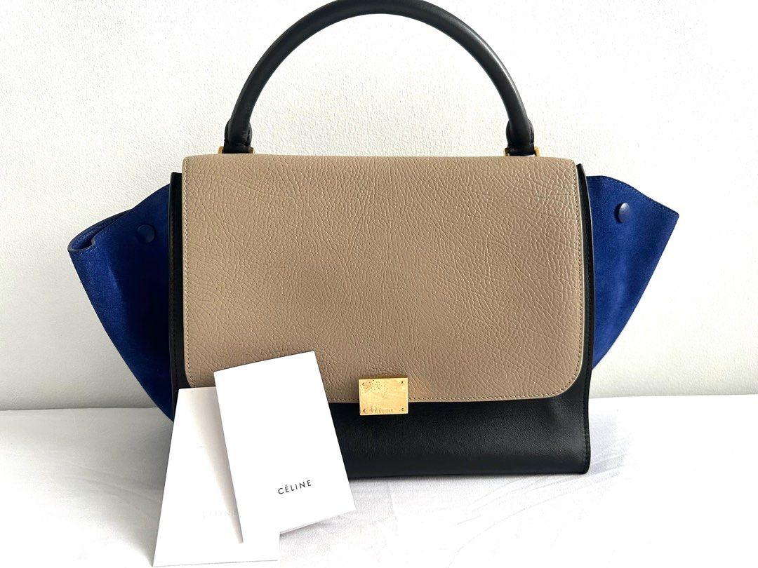 Preloved Celine Trapeze 2014 (Category: Luxury Bags & Wallets) located in Mandaluyong City. Submitted by czaristore (Listing ID 1291929641, Image 1). Description: • Authentic •lightly used •with slight tarnish on the buckle •comes with care card •no sling.