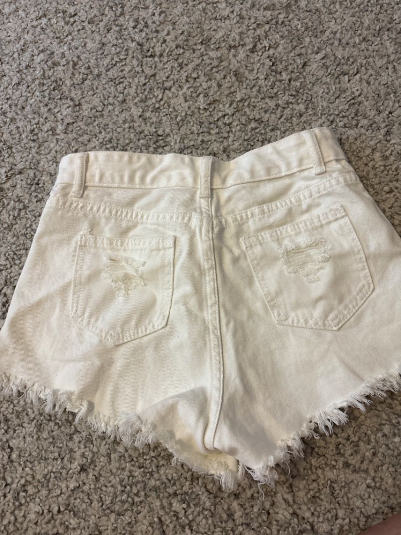 White shorts with rips on sale