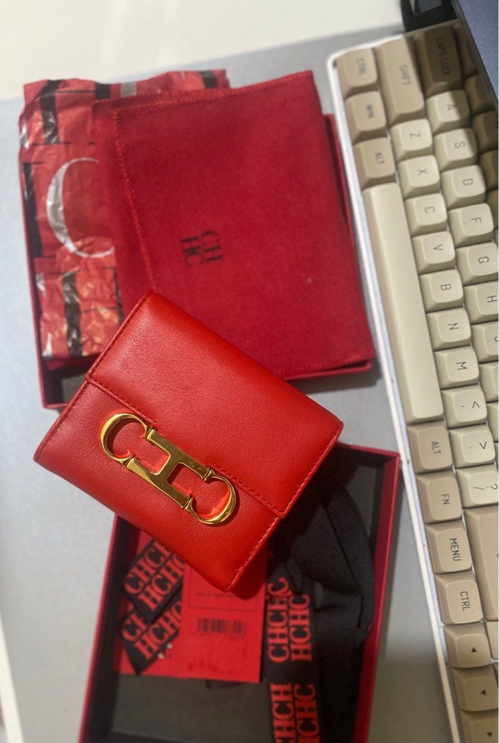 Carolina Herrera with CH insignia compact wallet. (Category: Wallets & Card holders) located in Makati City. Submitted by mycosmos1175267 (Listing ID 1296062197, Image 1). Description: Comes complete box Carolina Herrera box tags and ribbon with CH insignia compact wallet. In lucky red color Location: Makati/ Taguig Can ship via Grab/ Lalamove or GogoExpress Shipping c/o buyer Mode of Paymet: Gcash, BPI, GoTyme, Maya. .
