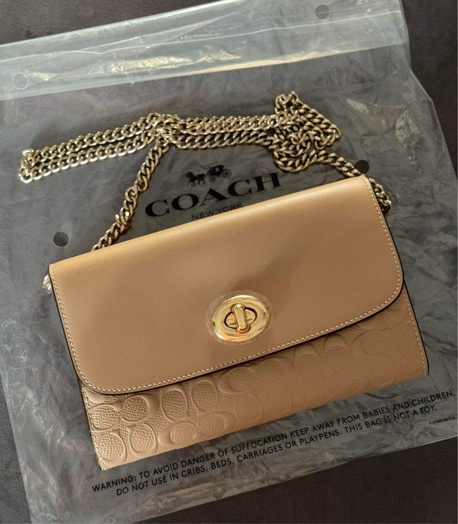 Coach wallet on chain (Category: Luxury Bags & Wallets) located in Mandaluyong City. Submitted by stuffnmore (Listing ID 1296180691, Image 2). Description: Super nice sa personal Coach wallet on chain embossed Turn lock Pinas onhand With 8 cardslot Kasya promax.