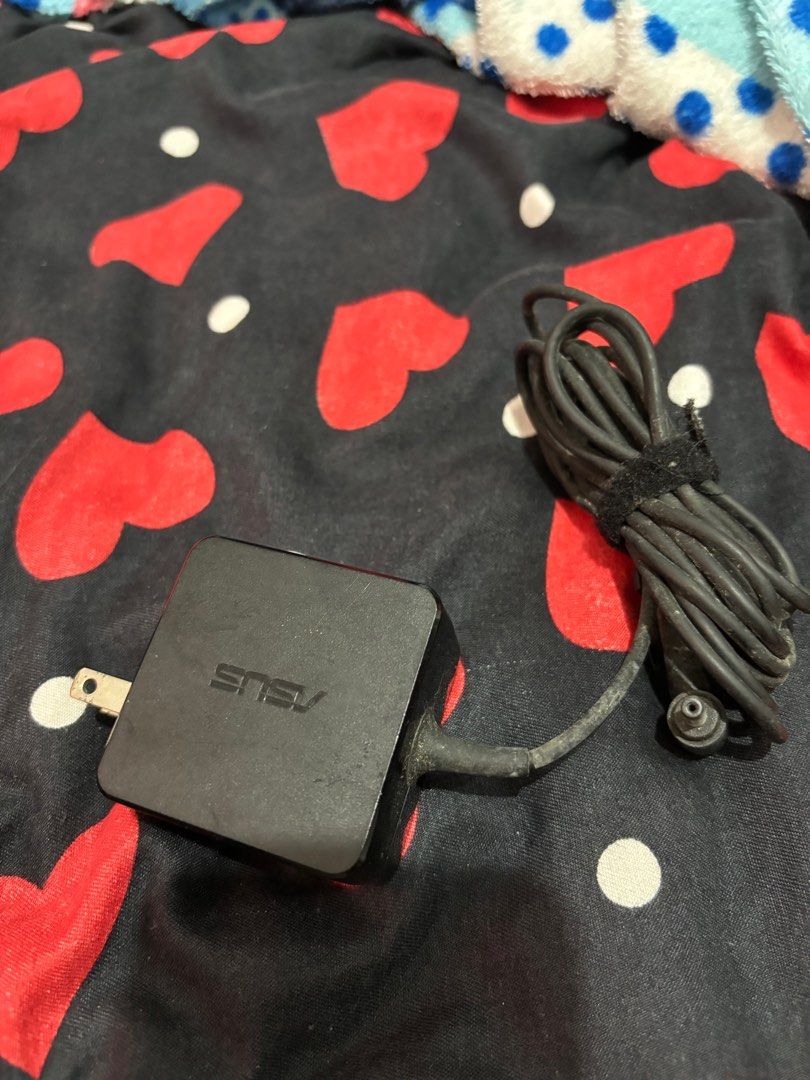 Asus charger (Category: Laptop Bags & Sleeves) located in Quezon City. Submitted by cmcrhs (Listing ID 1297597601, Image 1). Description: As is basis. No return no exchange..