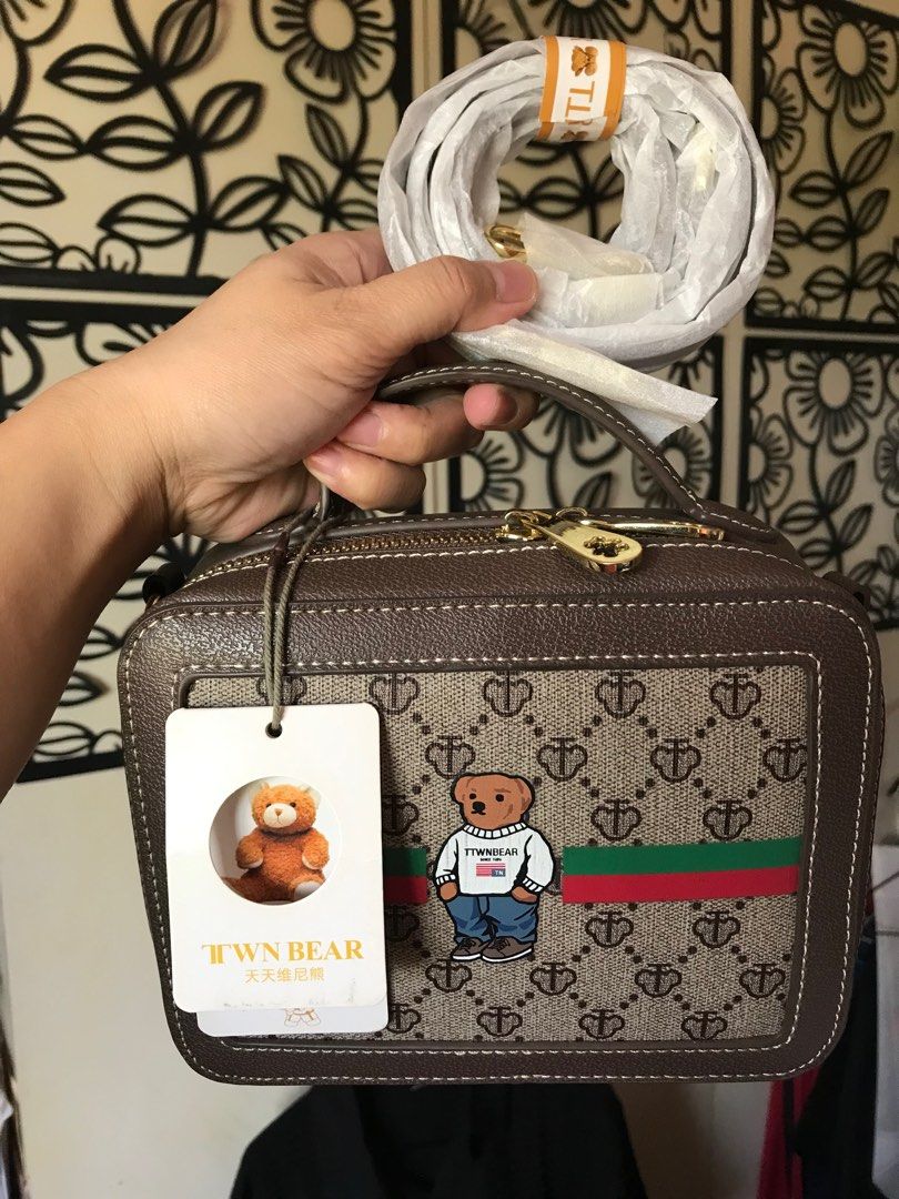 Brand new TTWN Bear camera vanity bag (Category: Luxury Bags & Wallets) located in Santa Rosa. Submitted by rina.rina3 (Listing ID 1297548718, Image 1). Description: Brand new with tag TTWN Bear camera vanity bag and with sling Gold hardware Double puller Can be a shoulder or crossbody bag Can also be a handbag Buyer to shoulder shipping fee Slightly negotiable .