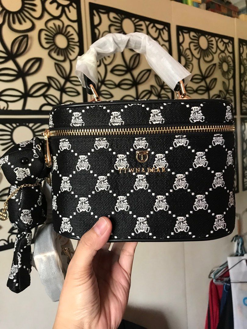 Brand new TTWN Bear vanity bag (Category: Luxury Bags & Wallets) located in Santa Rosa. Submitted by rina.rina3 (Listing ID 1297549445, Image 1). Description: Brand new with tag TTWN Bear vanity bag and with sling and bear 🧸 Gold hardware Double puller Can be a shoulder or crossbody bag Can also be a handbag Buyer to shoulder shipping fee Slightly negotiable .