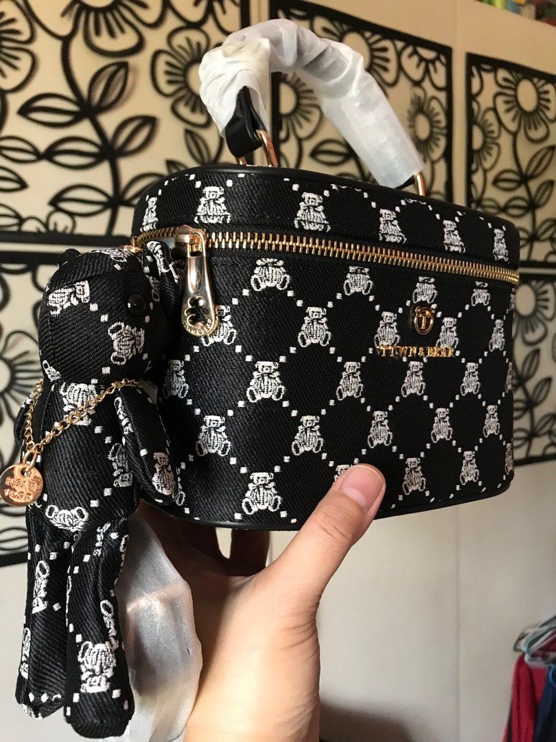 Brand new TTWN Bear vanity bag (Category: Luxury Bags & Wallets) located in Santa Rosa. Submitted by rina.rina3 (Listing ID 1297549445, Image 3). Description: Brand new with tag TTWN Bear vanity bag and with sling and bear 🧸 Gold hardware Double puller Can be a shoulder or crossbody bag Can also be a handbag Buyer to shoulder shipping fee Slightly negotiable .