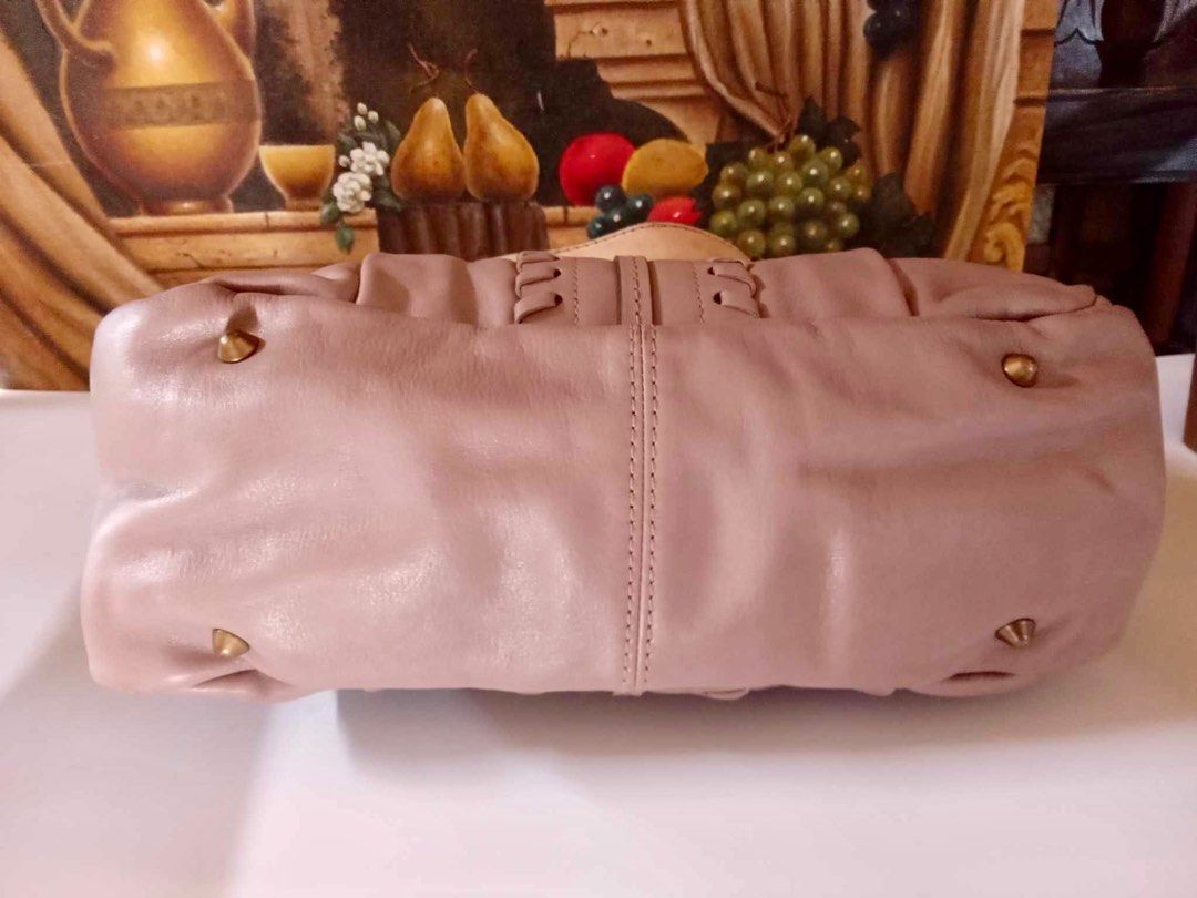 Chloe Powder Pink Braided Handbag (Category: Luxury Bags & Wallets) located in Muntinlupa City. Submitted by phbudgetluxuryfinds (Listing ID 1297635013, Image 2). Description: *****You are buying an authentic Chloe handbag*** ✅preloved and steal price ✅ with authenticity card and hologram sticker is also intact ✅ excellent condition ✅ color is powder pink Last photo is for size reference only .