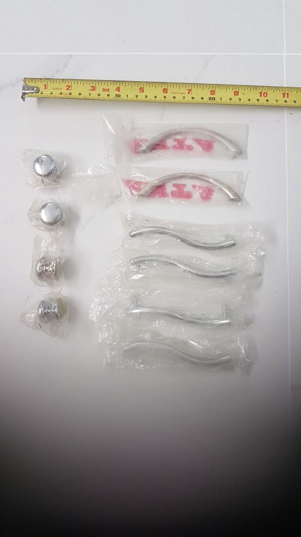 Knobs and handles (Category: Home Improvement Tools & Accessories) located in Singapore. Submitted by sgcatlover (Listing ID 1297621796, Image 1). Description: Assorted drawer door knobs and handles leftover from reno. Brand new sealed in plastic. $0.50 per piece ($1 per pair). Screws not included. Round knob - 4 pcs Arc handle - 2 pcs Wavy handle - 4 pcs Self collect. .