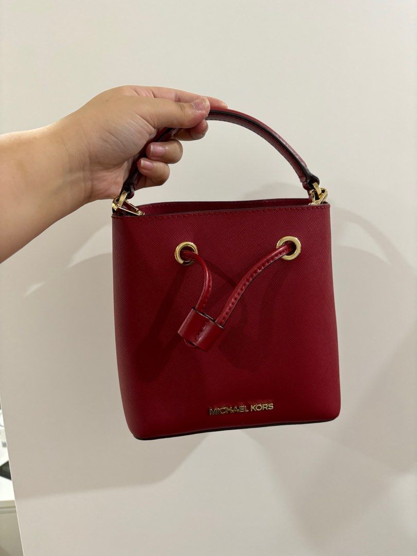 Michael Kors Small Red Bucket Bag (Category: Luxury Bags & Wallets) located in Bacoor. Submitted by shop.cza (Listing ID 1297659954, Image 1). Description: Authentic from Japan Mini Bucket Bag Can fit iPhone 15, kindle paperwhite.