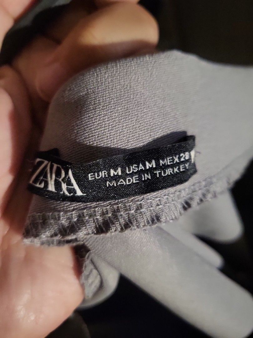 Zara Top (Category: Blouses) located in Manila. Submitted by declutterwithme__ (Listing ID 1297630766, Image 3). Description: Zara Grey Asymmetrical top fits small to medium worn once nice for corporate.