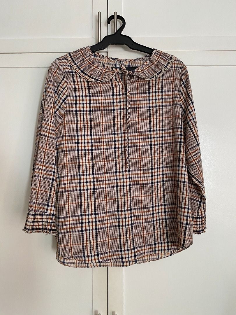 Daorae Plaid/Checkered Blouse (Category: Blouses) located in Quezon City. Submitted by briesells (Listing ID 1297744024, Image 1). Description: RFS: Decluttering. Need funds. Negotiable. Please message. Details: - Brand: Daorae - Size on tag: no size on tag but can fit up to size L - Color: shades of brown and black - No defects/issues. See my account bio for details on shipping and reservation (:.