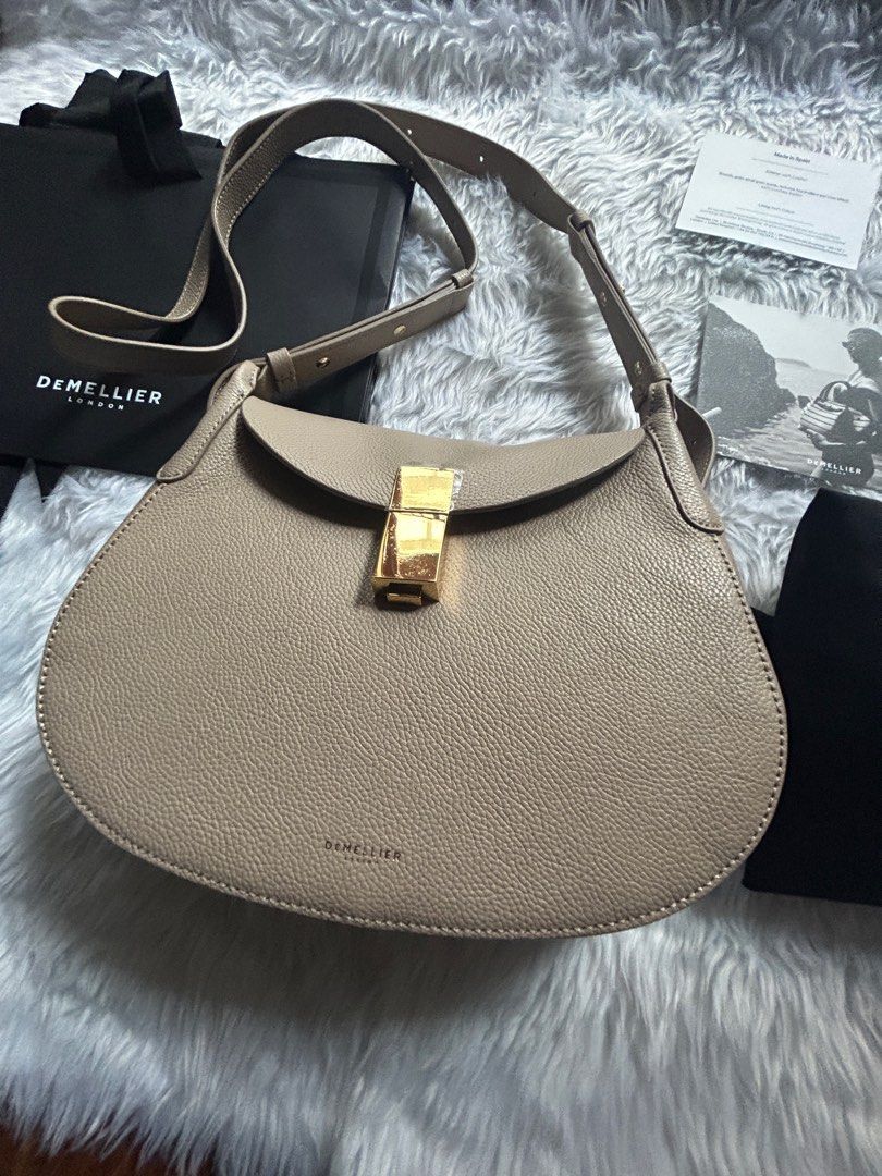 DeMellier Lausanne in Taupe (Regular Size) (Category: Luxury Bags & Wallets) located in Manila. Submitted by 0idiotsavant0 (Listing ID 1297741292, Image 2). Description: Brand new, never used Straight out of the box Purchased directly from the DeMellier London website last month (I got the very last piece) I just attached the strap to try it on Still with protective covers for the clasp hardware Comes complete with dust bag, adjustable strap, car