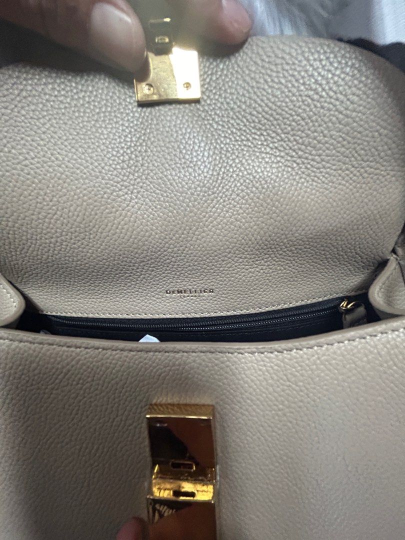 DeMellier Lausanne in Taupe (Regular Size) (Category: Luxury Bags & Wallets) located in Manila. Submitted by 0idiotsavant0 (Listing ID 1297741292, Image 3). Description: Brand new, never used Straight out of the box Purchased directly from the DeMellier London website last month (I got the very last piece) I just attached the strap to try it on Still with protective covers for the clasp hardware Comes complete with dust bag, adjustable strap, car