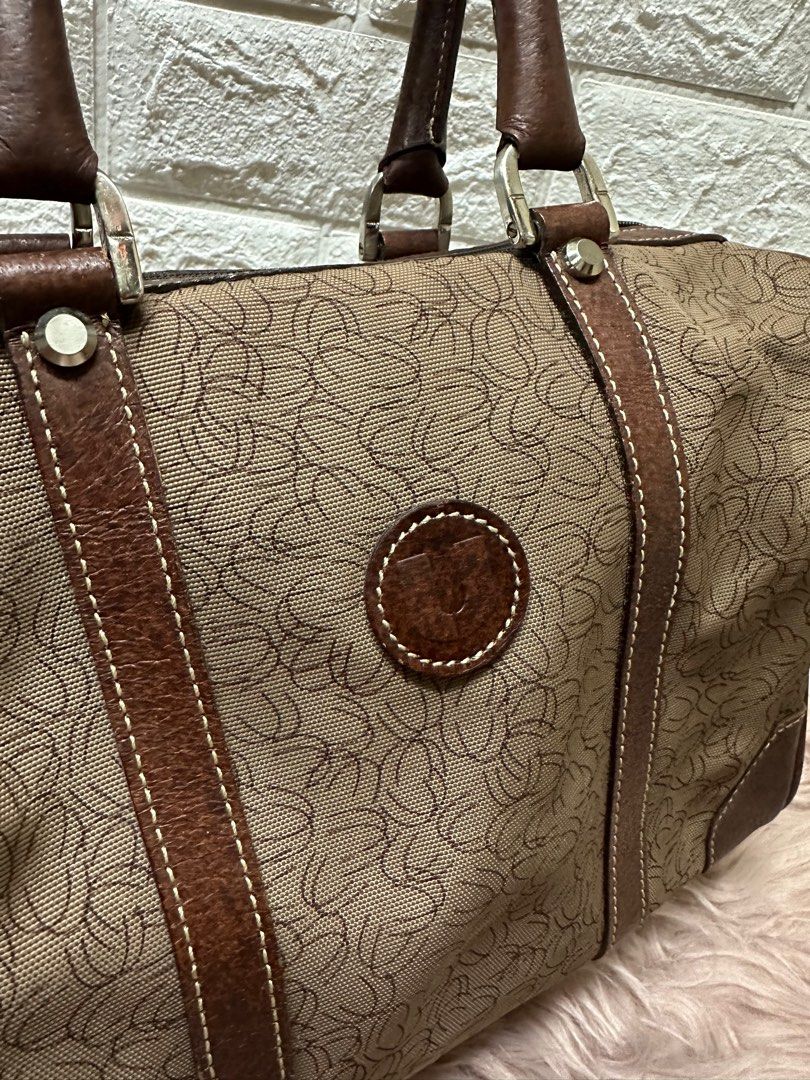 Emanuel Ungaro Paris Boston Bag (Category: Luxury Bags & Wallets) located in Manila. Submitted by rarefindsgallery (Listing ID 1297761825, Image 1). Description: Authentic Emanuel Ungaro Paris Boston Overnight Bag 💼 Size: L 11” x H 8.5” x D 6.5” Material: Leather and canvas Authentic leather handle and lining Silver hardware YKK zipper With zipped pocket inside Super nice in actual 👌 With minimal signs of use Light scratches on leather With som
