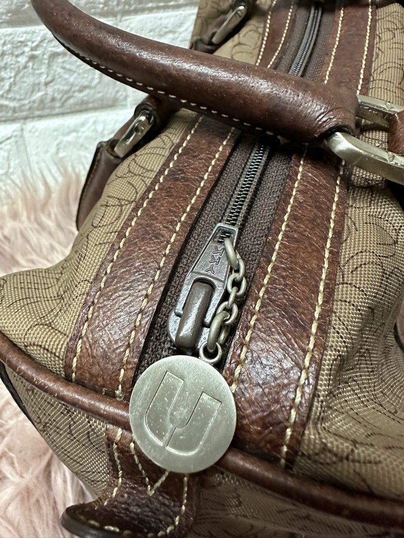 Emanuel Ungaro Paris Boston Bag (Category: Luxury Bags & Wallets) located in Manila. Submitted by rarefindsgallery (Listing ID 1297761825, Image 3). Description: Authentic Emanuel Ungaro Paris Boston Overnight Bag 💼 Size: L 11” x H 8.5” x D 6.5” Material: Leather and canvas Authentic leather handle and lining Silver hardware YKK zipper With zipped pocket inside Super nice in actual 👌 With minimal signs of use Light scratches on leather With som