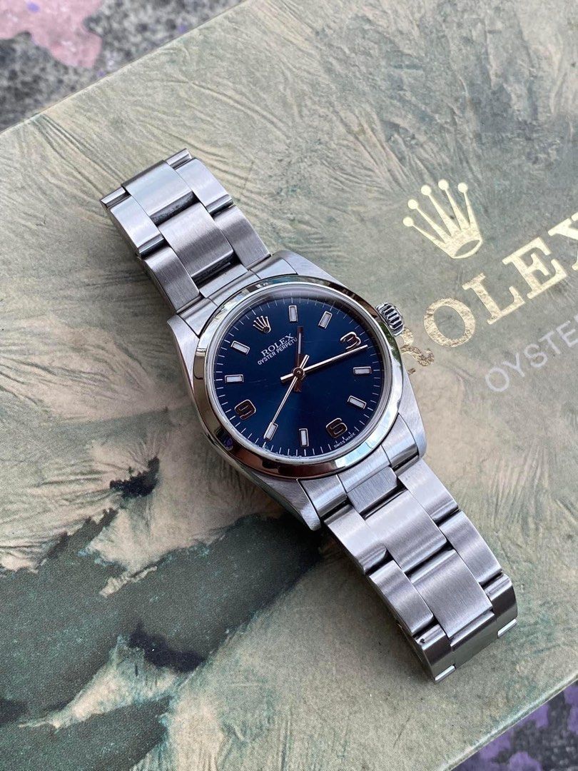rolex (Category: Luxury Watches) located in Cabanatuan. Submitted by albertgonzales27 (Listing ID 1297744735, Image 3). Description: Rolex Oyster Perpetual 31mm 77080 Reference no. 2002 Year Model 3 6 9 Blue Dial 10.5 Pcs Links With Box Only Condition : 9.3/10 .