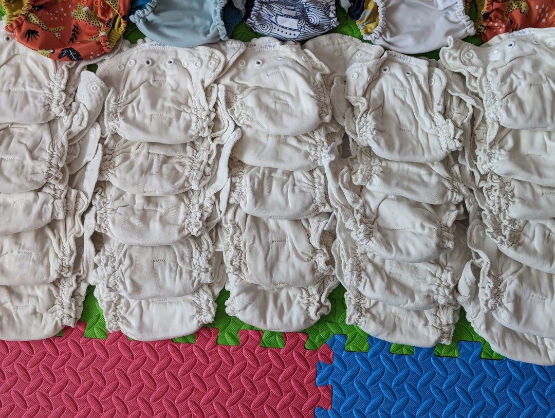 Esembly Cloth Diaper Bundle (Category: Diapers & Baby Wipes) located in Balanga. Submitted by crienahouse (Listing ID 1297881945, Image 3). Description: Esembly Diapers from the States Size 1 (7-17lbs, birth-6mos approx) 26 Inners - organic cotton (the only brand I could find in this fabric, no stains) 5 outers Take all only, last price Will offer 4 overnight pads for free for buyer total of $430 worth of items. this saved us a lot of money and t