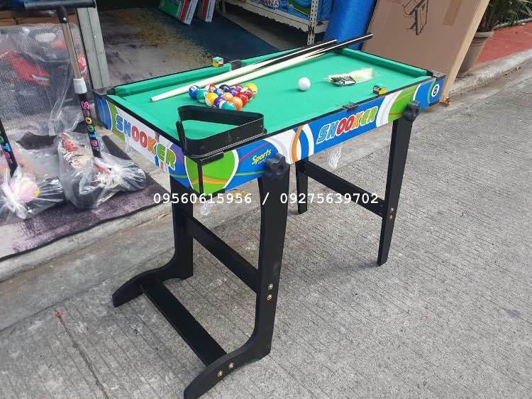 MINI BILLIARD TABLE FOR SALE (Category: Billiards and Bowling) located in Manila. Submitted by zainabonlineshop (Listing ID 1297871360, Image 2). Description: Code: Daniel Billiard Set 1136A Size: H: 67cm x L: 79cm x W: 43cm ✅️ high quality wooden materials ✅️ complete set with billiard accessories ✅️ Foldable, easy to keep and assemble ✅️ Best for 4 to 9 yrs old.