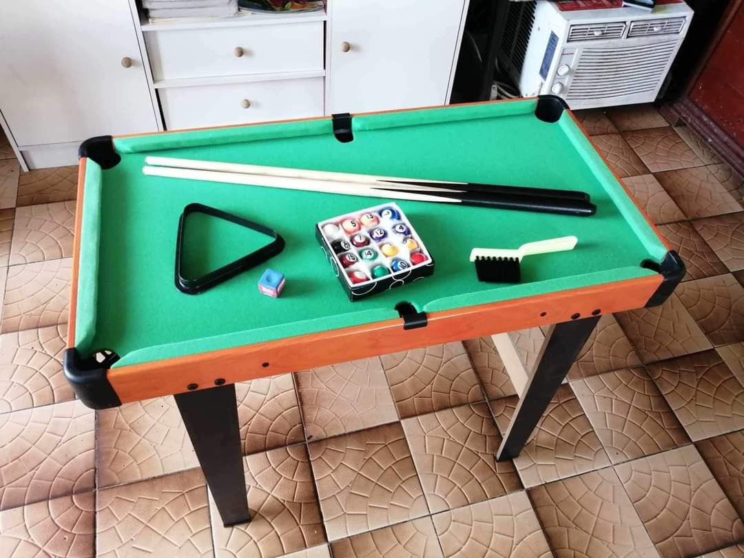 Mini Billiard Table Set for Kids 76*40*58cm (Category: Kids Toys) located in Caloocan City. Submitted by onlineshoppersph (Listing ID 1297836221, Image 1). Description: Mini billiard Available ganian sizes😍 76x40x58cm inclusion : 🎱 table pool with stand 🎱16 pcs marble balls 🎱2 pcs wooden taco 🎱1 tisa 🎱1 triangle ✅100% Brand New ✅Good Quality Cash On Deliver - Metro Manila - Delivery Fee/Handling Fee shouldered by BUYERS - DF/HF depends on B