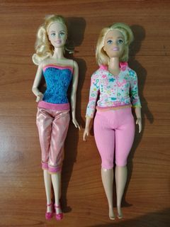 Take both Barbie dolls