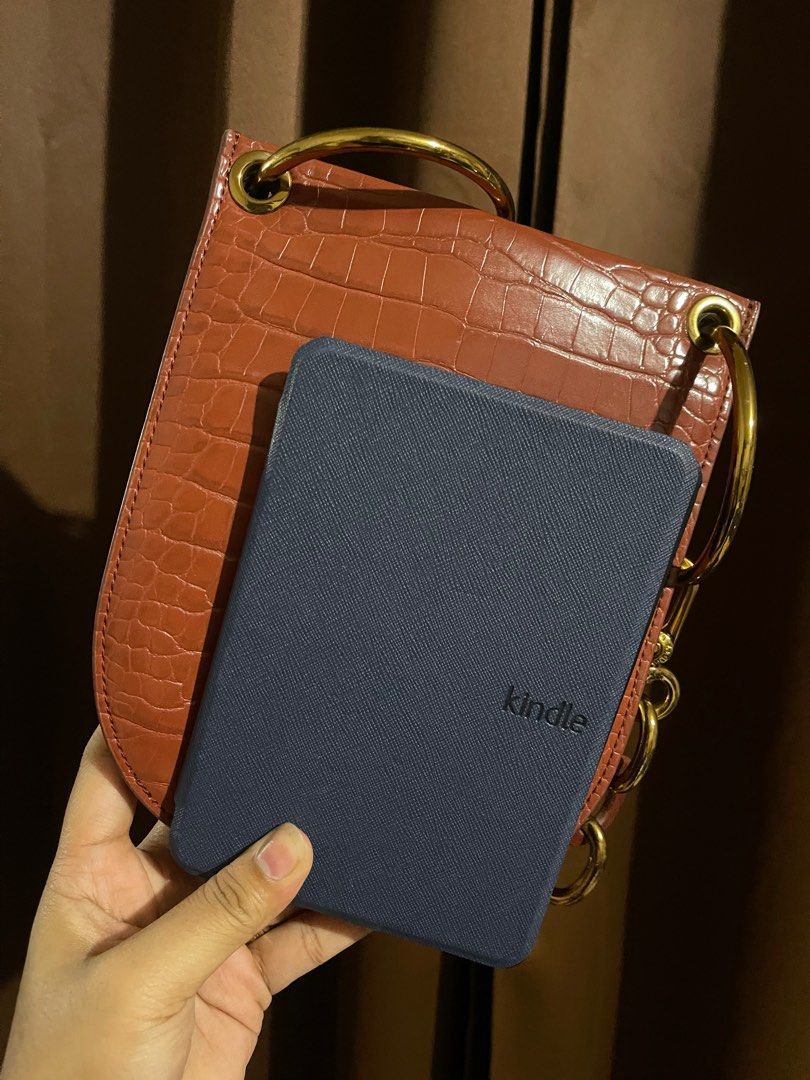 Charles and Keith U-Shaped Croc Effect Bag (Category: Cross-body Bags) located in Naga. Submitted by _eraaa (Listing ID 1298283802, Image 2). Description: Authentic Charles and Keith CROC-EFFECT CHUNKY CHAIN HANDLE U-SHAPED CROSS BODY BAG - TAN Bought during travels, can fit Iphone 12 pro max and credit cards, few cash Minimal scratches on chains, bag belt is missing Won’t include the card slot inside Delivery, no meet up, No COD.