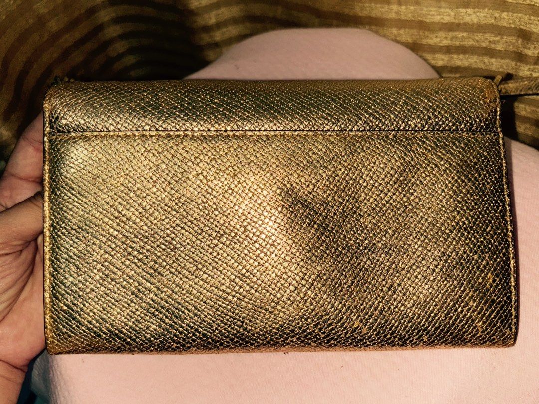 Michael Kors Sling Wallet/Clutch (Category: Luxury Bags & Wallets) located in Candaba. Submitted by adadp24 (Listing ID 1298244018, Image 2). Description: Color Gold with Minor signs of usage, not obvious when worn, still ok for everyday use.
